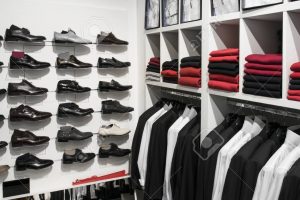 Clothes and shoes on the shelves in the store